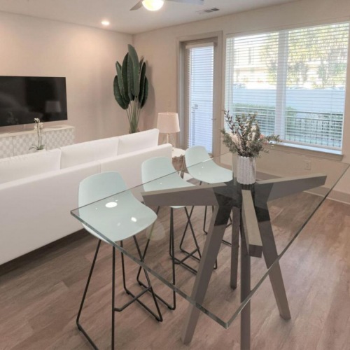 Beautiful living spaces with natural lighting a dining room with a large table