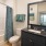 a bathroom with a tub sink and a toilet