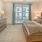 a bedroom with a large mirror