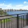 a view of a city across the water from a balcony