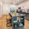 a kitchen with a bar stool and a bar stool