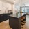 a kitchen with a bar and island