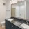 a bathroom with a large mirror